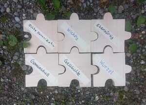 [Translate to Français:] Waldcoaching Holz Puzzlesteine